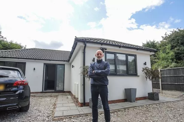 Mark Jones outside the bungalow he has been ordered to demolish.