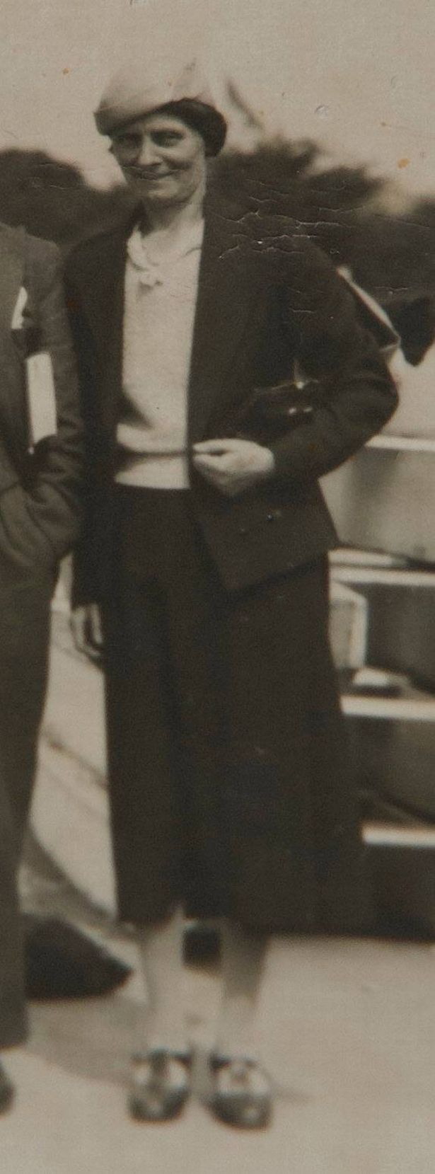An old picture of a woman wearing a hat