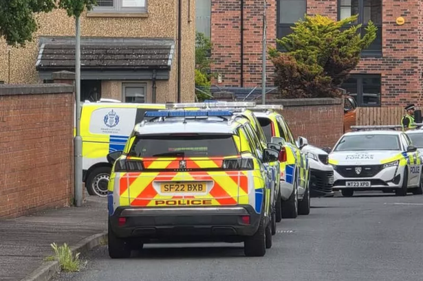 Police on Muirhouse Drive, Edinburgh.