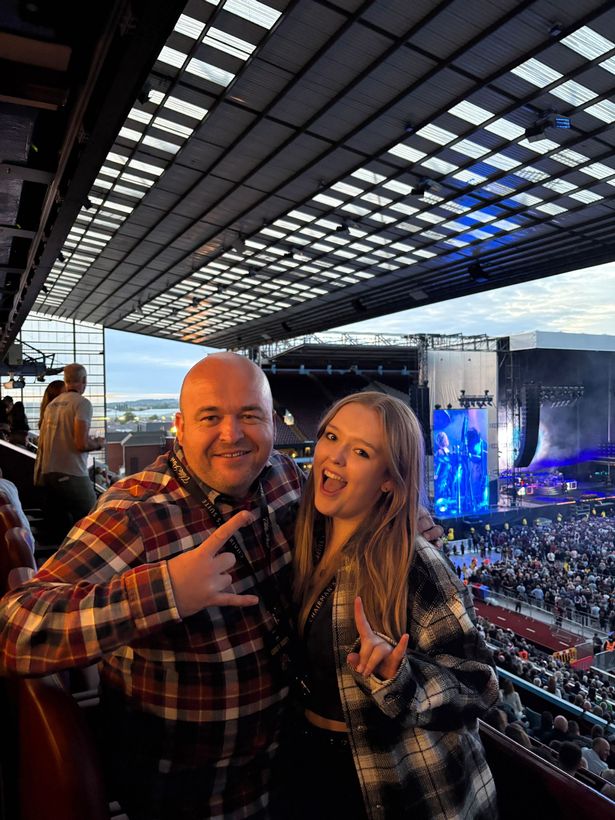 Steve Wollaston and daughter Lily enjoying Guns N' Roses at Villa Park