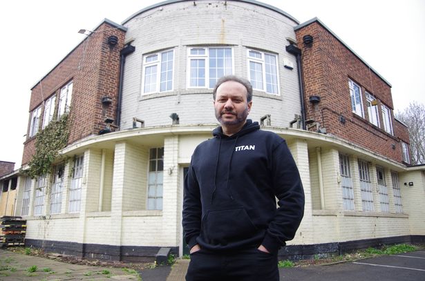 Businessman Tariq Muhammad with the former Merchants Arms pub in Eastville
