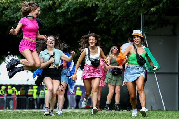  Music fans arrive for day two of the TRNSMT Festival 2024 at Glasgow Green on July 13, 2024 in Glasgow, Scotland.