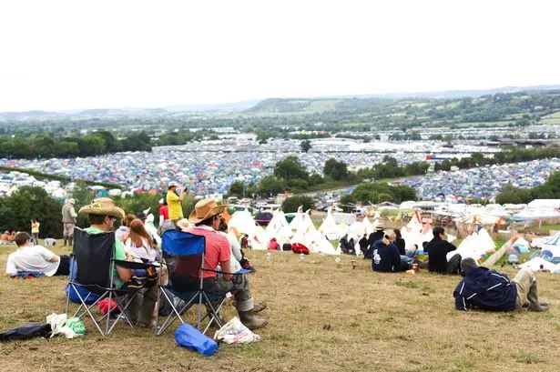 Festival goers overlooking the camp sites at Glastonbury Festival 2011, Worthy Farm, Pilton. This year's headline acts were U2, Coldplay and Beyonce.