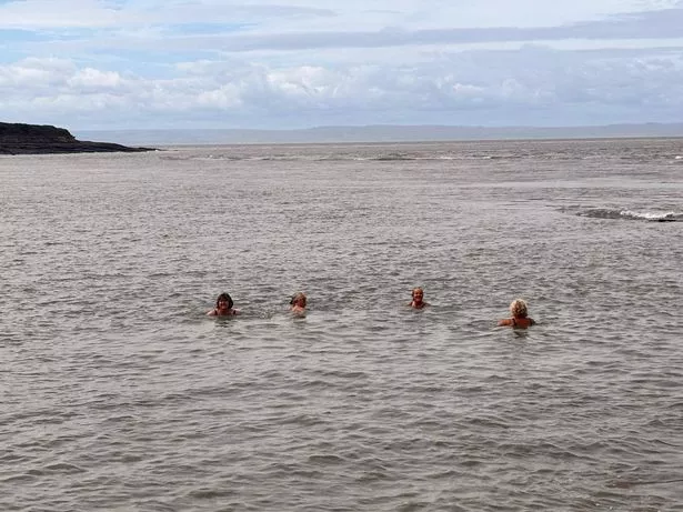 Susan and her friends enjoying their daily sea dip