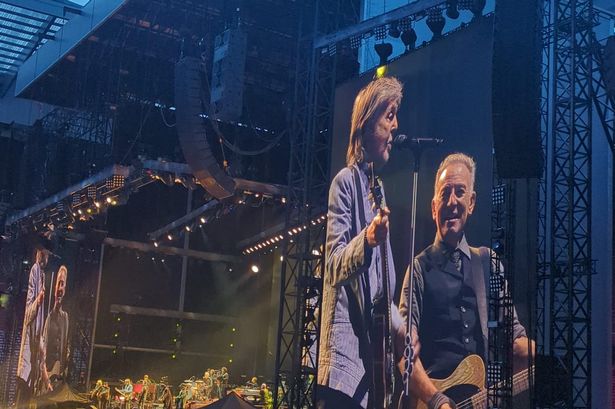Sir Paul McCartney and Bruce Springsteen on stage at Anfield