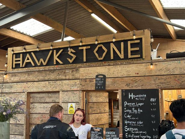 People queue at the bar for Hawkston beer