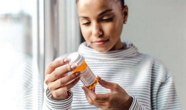 Woman taking medication
