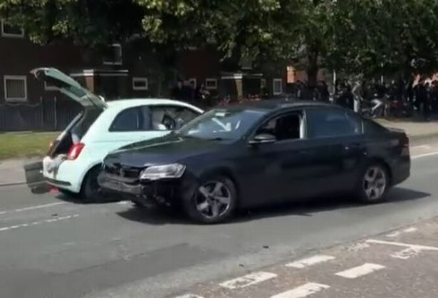Two cars, one with the bumper missing, were being driven erratically