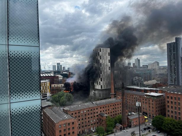 Black smoke billows into the sky
