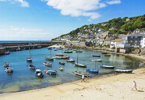 fishing boats in the harbor at mousehole, Cornwall, England, Britain, uk.
