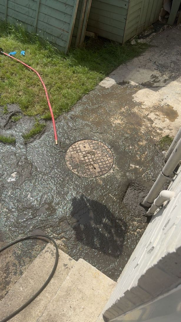 Sewage bubbling up from a drain in Melanie McMahon's garden