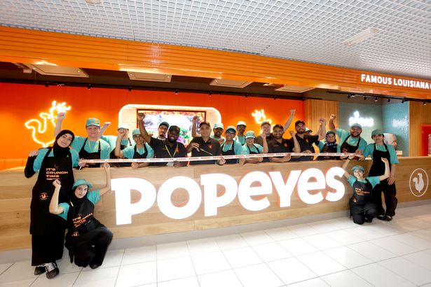 Staff at the new Popeyes fast food restaurant at Birmingham Airport are ready to service hungry passengers before they take to the skies 