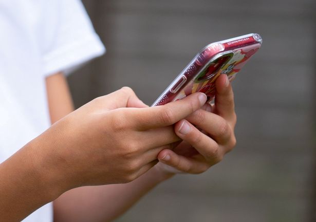 A child using a mobile phone