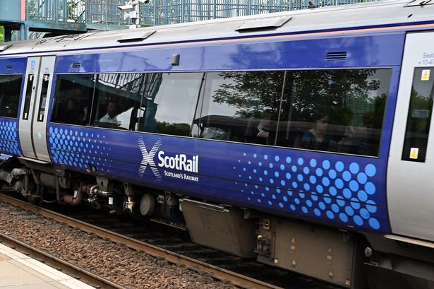 A ScotRail train passes through a station in Fife