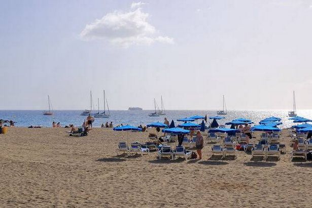 the beach of the village Los Cristianos, Tenerife at noon