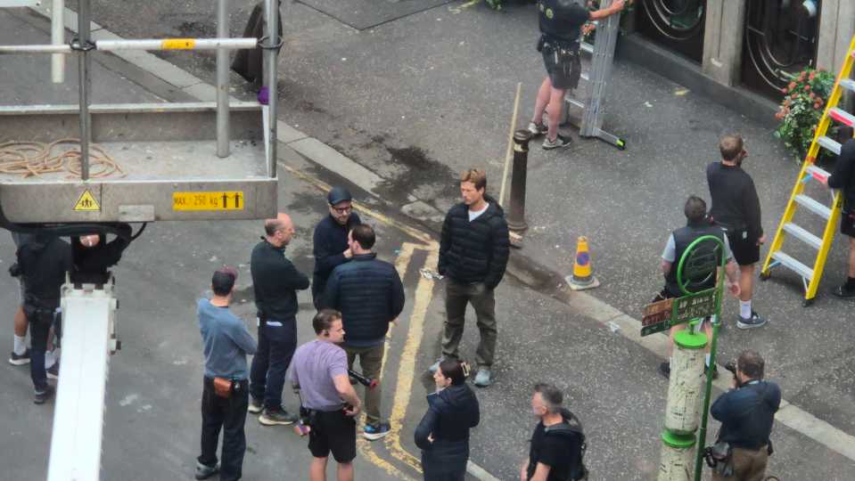 Film crew on a city street.