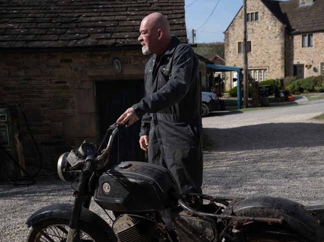 Bear stands by his motorbike in Emmerdale