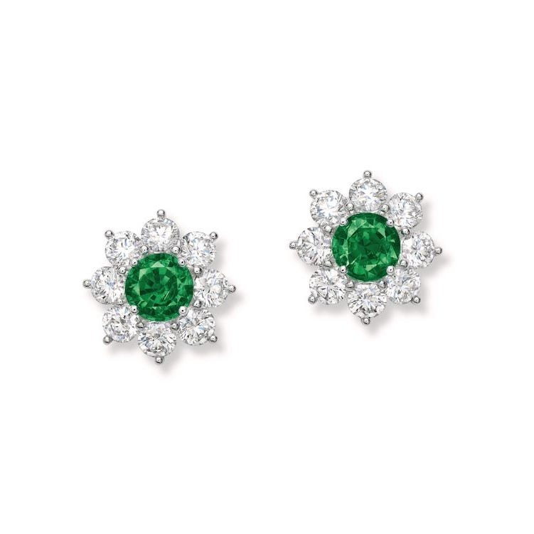 Emerald and diamond stud earrings shaped like flowers