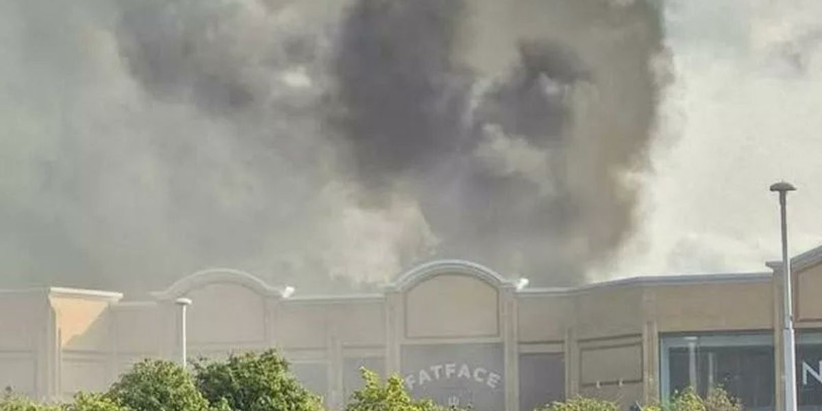 Huge fire rips through Britain's second largest retail park as smoke billows through the sky and can be seen for miles