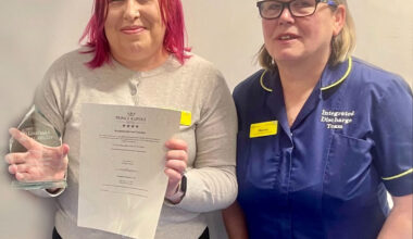 Natalie Chambers, left, with her award for helping the homeless, alongside colleague Marcia Coutts