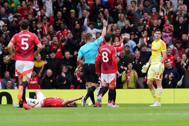 Emiliano Martinez leaves the field after being sent off against Manchester United