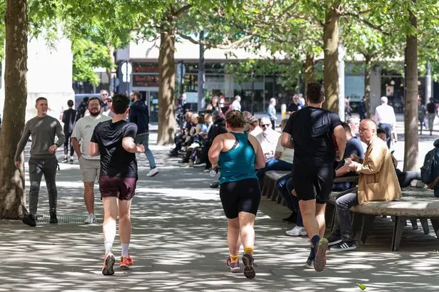 GVs across central Manchester, as the city basks in the summer sun.
