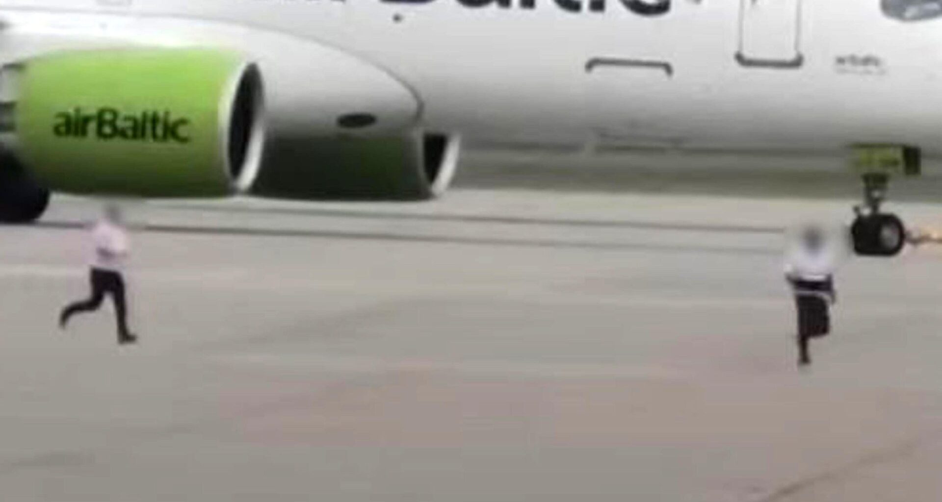 Shocking moment man is chased across taxiway at Heathrow Airport near moving aircraft before being arrested