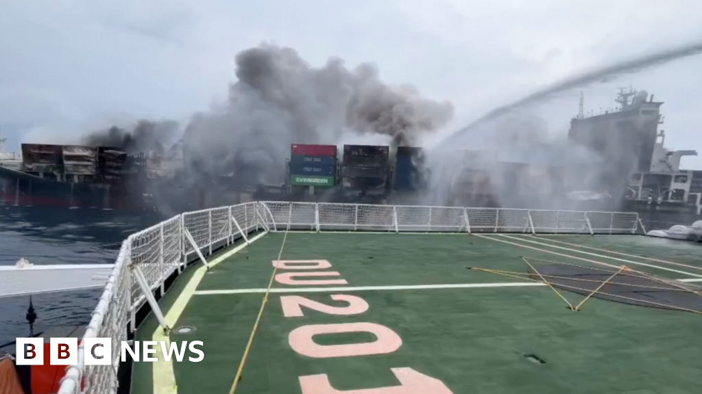 Officials race to tow burning ship away from India coast to prevent 'ecological disaster'