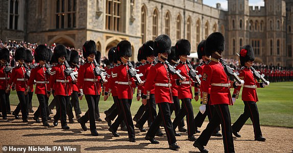 Members of the Coldstream Guards march during a ceremony at Windsor Castle, Berkshire, where King Charles III, Colonel-in-Chief of the Coldstream Guards, presents four new Colours to the 1st and 2nd Battalion (Number 7 Company) of the Coldstream Guards in their 375th year. The new Colours will be those trooped in the Trooping of the Colour at the King's official Birthday Parade in London on Saturday June 14. Picture date: Friday June 13, 2025. PA Photo. Photo credit should read: Henry Nicholls/PA Wire
