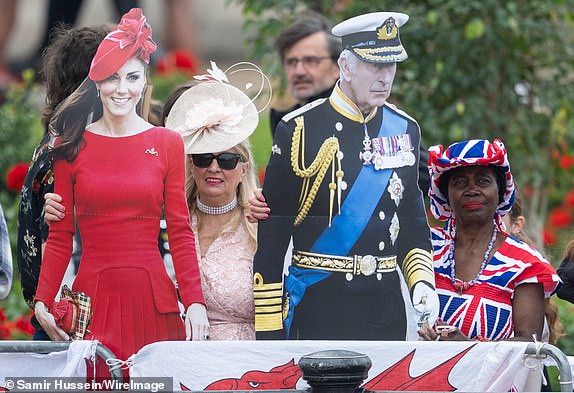 LONDON, ENGLAND - JUNE 14: Well wishers gather ahead of Trooping The Colour 2025 on June 14, 2025 in London, England. Trooping The Colour is a ceremonial parade celebrating the official birthday of the British Monarch. The event features over 1,400 soldiers and officers, accompanied by 200 horses. More than 400 musicians from ten different bands and Corps of Drums march and while performing. (Photo by Samir Hussein/WireImage)