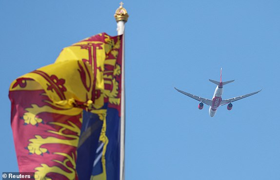 An Air India passenger airplane flies over the Buckingham Palace, ahead of the Trooping the Colour parade to honour Britain's King Charles on his official birthday in London, Britain, June 14, 2025. REUTERS/Toby Melville