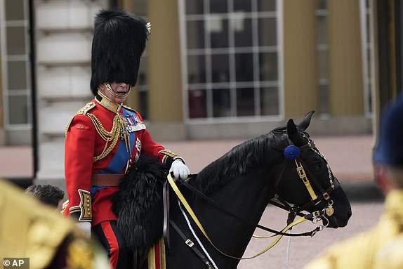 FILE - Britain's King Charles III attends the Trooping The Colour parade, in London, June 17, 2023. Trooping the Colour is the King's Birthday Parade and one of the nation's most impressive and iconic annual events attended by almost every member of the Royal Family.(AP Photo/Alastair Grant, File)