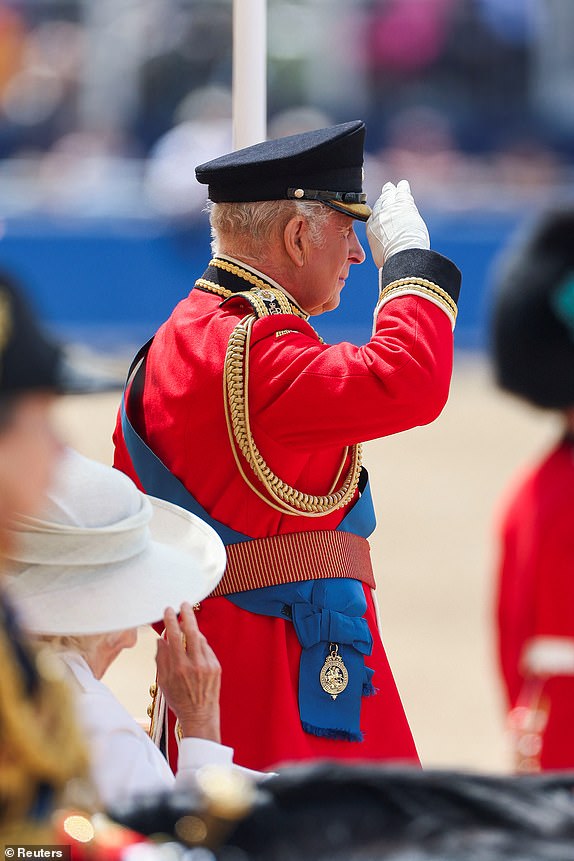 Britain's King Charles and Queen Camilla attend the Trooping the Colour parade which honours Britain's King Charles on his official birthday, in London, Britain, June 14, 2025. REUTERS/Isabel Infantes