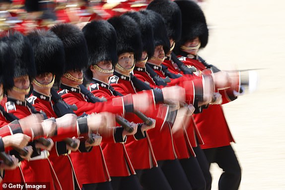 LONDON, ENGLAND - JUNE 14: The Irish Guards parade down The Mall during Trooping The Colour 2025 on June 14, 2025 in London, England. Trooping The Colour is a ceremonial parade celebrating the official birthday of the British Monarch. The event features over 1,400 soldiers and officers, accompanied by 200 horses. More than 400 musicians from ten different bands and Corps of Drums march and while performing. (Photo by John Phillips/Getty Images)