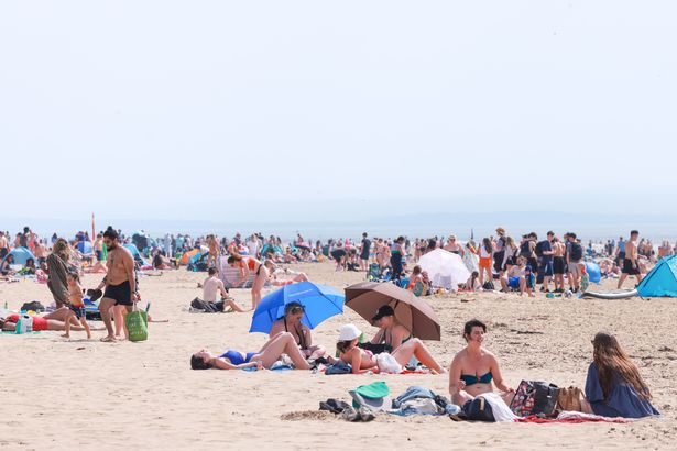 People enjoy the hot weather on Formby beach