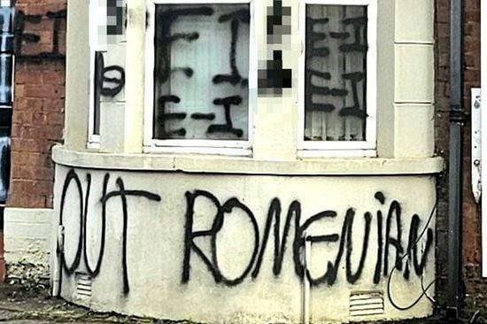 Graffiti daubed on Belfast home targeting Romanian community condemned as police probe ‘hate-motivated criminal damage’
