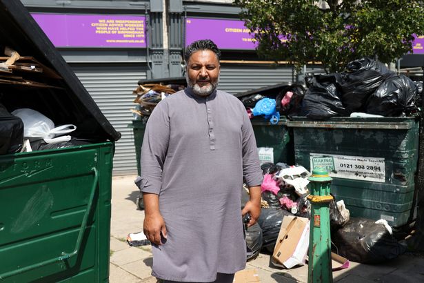 Aftab Hamid with rubbish on Court Road, Balsall Heath, Birmingham.