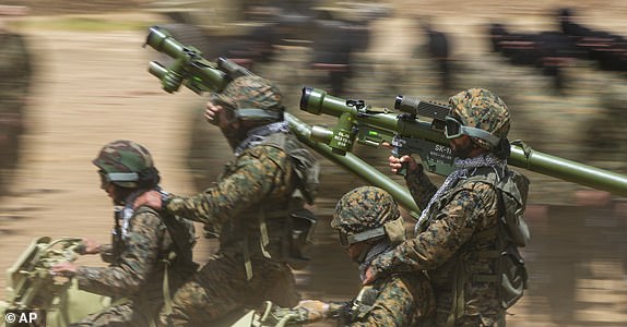 FILE - Fighters from the Lebanese militant group Hezbollah train in southern Lebanon, May 21, 2023. (AP Photo/Hassan Ammar, File)