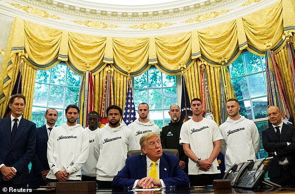 U.S. President Donald Trump meets with players of the Juventus soccer team in the Oval Office of the White House in Washington, D.C., U.S., June 18, 2025. REUTERS/Nathan Howard