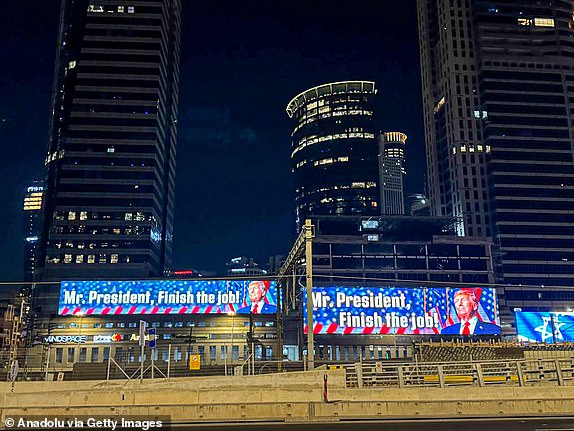 TEL AVIV, ISRAEL - JUNE 19: A view of the digital billboards reading 'Mr. President, Finish the job!' referring to US President Donald Trump on June 19, 2025 in Tel Aviv, Israel (Photo by Enes Canli/Anadolu via Getty Images)
