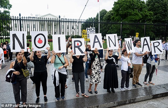 Pro-Palestinian demonstrators protest the Israeli strikes on Iran and any potential US involvement in the conflict during a "No War on Iran" demonstration outside the White House in Washington, DC, on June 18, 2025. US President Donald Trump said on June 18 that he was still deciding whether to join Israel's strikes on Iran, claiming Tehran now wants talks at the White House but may have waited too long. (Photo by SAUL LOEB / AFP) (Photo by SAUL LOEB/AFP via Getty Images)