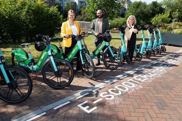Scooters and bikes are now available at Lyde Green Park & Ride along with their own parking bay. West of England Mayor Helen Godwin, Iqbal Ahmed from Tier/Dott, and South Gloucestershire councillor Chris Willmore.