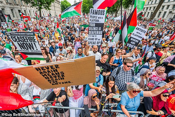 Mandatory Credit: Photo by Guy Bell/Shutterstock (15367885w) The crowd cheers speaches outside Downing Street - The latest National March for Palestine in London, stating in Russell Square and ending Whitehall. The protest takes place as Israel continues its assault on Gaza under cover of its new assault on Iran. Another National Demo for Palestine, London., Westminster, UK - 21 Jun 2025