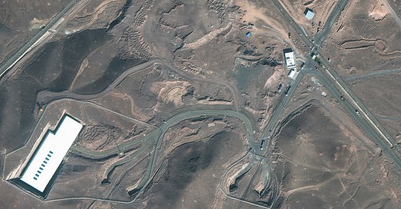 This handout satellite image courtesy of Maxar Technologies shows cargo trucks postioned near an underground entrance to Iran's Fordow Fuel Enrichment Plant (FFEP), in Fordo, Iran on June 20, 2025. President Donald Trump on June 21, 2025 warned Iran to not respond after US strikes targeted its main nuclear enrichment facilities in attacks he called a "spectacular military success." President Donald Trump said June 21, 2025 the US military has carried out a "very successful attack" on three Iranian nuclear sites, including the underground uranium enrichment facility at Fordo. "We have completed our very successful attack on the three Nuclear sites in Iran, including Fordow, Natanz, and Esfahan," Trump said in a post on his Truth Social platform. (Photo by Satellite image Â©2025 Maxar Technologies / AFP) / RESTRICTED TO EDITORIAL USE - MANDATORY CREDIT "AFP PHOTO / Satellite image Â©2025 Maxar Technologies"  - NO MARKETING NO ADVERTISING CAMPAIGNS - DISTRIBUTED AS A SERVICE TO CLIENTS (
