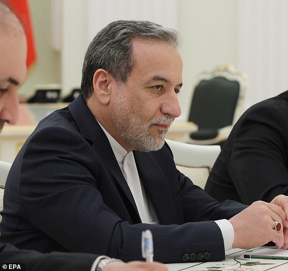epa12037070 Iranian Foreign Minister Seyed Abbas Araghchi (C) and Iranian Ambassador to Russia Kazem Jalali (R) attend a meeting with Russian President Vladimir Putin at the Kremlin in Moscow, Russia, 17 April 2025. Seyed Abbas Araghchi is on a two days working visit to Moscow.  EPA/GAVRIIL GRIGOROV / SPUTNIK / KREMLIN POOL MANDATORY CREDIT