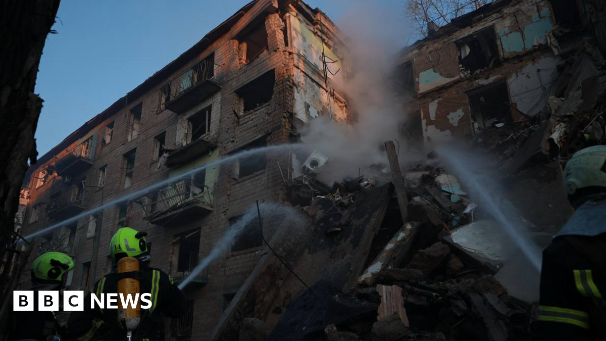 Rescuers from Ukraine's emergencies service DSNS tackle fire in a residential building destroyed in a Russian missile and drone attack on Kyiv. Photo: 23 June 2025