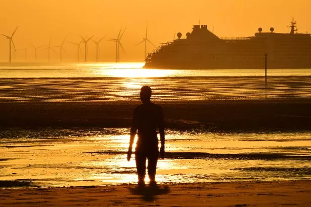 Heatwave weather as sunsets on Crosby Beach