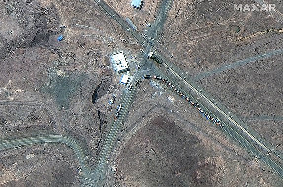 This handout satellite picture provided by Maxar Technologies and taken on June 19, 2025, shows trucks positioned near the entrance of Iran's Fordow Fuel Enrichment Plant (FFEP), northeast of the city of Qom. President Donald Trump said US air strikes early on June 22 "totally obliterated" Iran's main nuclear sites, as Washington joined Israel's war with Tehran in a flashpoint moment for the Middle East. (Photo by Satellite image Â©2025 Maxar Technologies / AFP) / RESTRICTED TO EDITORIAL USE - MANDATORY CREDIT "AFP PHOTO/ SATELLITE IMAGE Â©2025 MAXAR TECHNOLOGIES" - NO MARKETING NO ADVERTISING CAMPAIGNS - DISTRIBUTED AS A SERVICE TO CLIENTS - THE WATERMARK MAY NOT BE REMOVED/CROPPED (Photo by -/Satellite image Â©2025 Maxar Technologies/AFP via Getty Images)