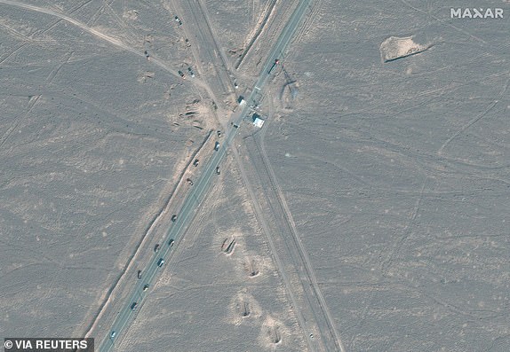 A satellite image shows new vehicle revetments and trucks on the road 1.1 kilometres from the Fordow nuclear facility, near Qom, Iran June 20, 2025. Maxar Technologies/Handout via REUTERS    THIS IMAGE HAS BEEN SUPPLIED BY A THIRD PARTY. NO RESALES. NO ARCHIVES. MANDATORY CREDIT. MUST NOT OBSCURE LOGO