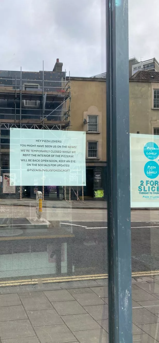 A notice on the Pizzeria's window explains that they are "temporarily closed"